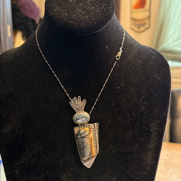 One of a kind artisan created Picasso hand and hematite sterling silver pendant